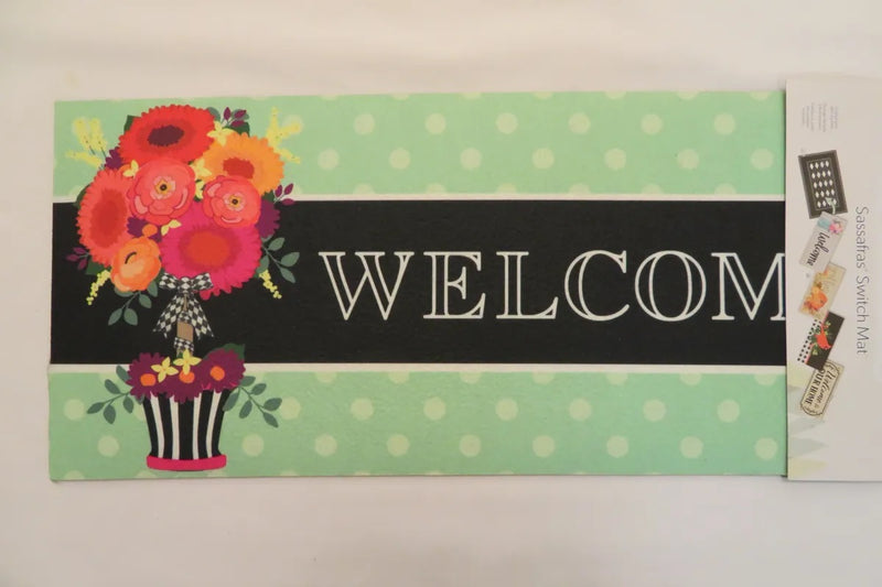“Welcome” With Flower Pot Sassafras Switch Mat - Monogram Market